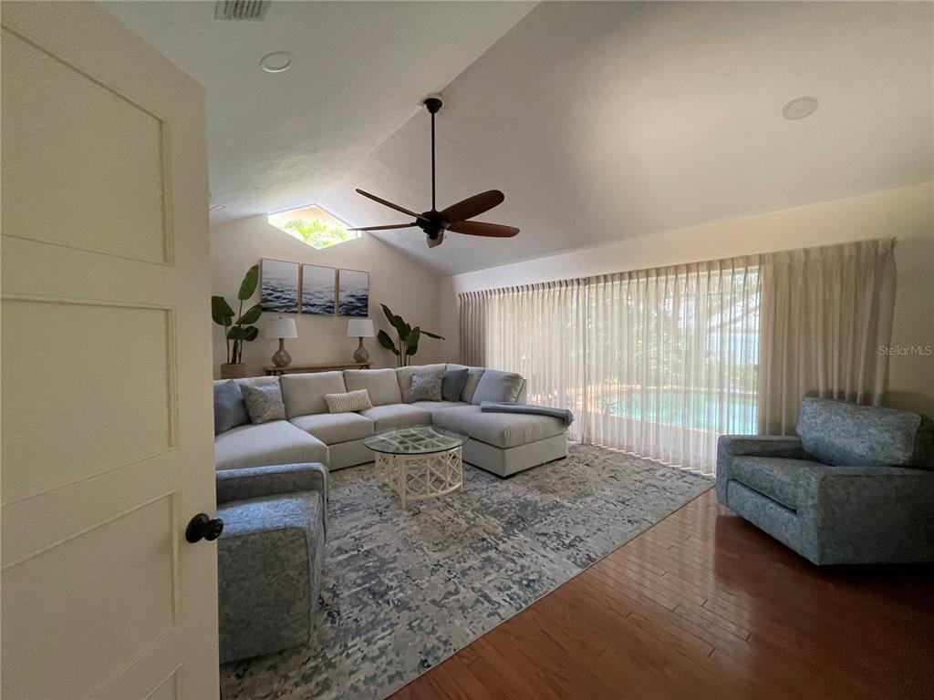 421 Waterside Lane Nokomis, FL 34275 - Photo 8 of 48 a living room with furniture and a window