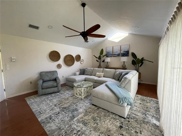 a living room with furniture and a rug