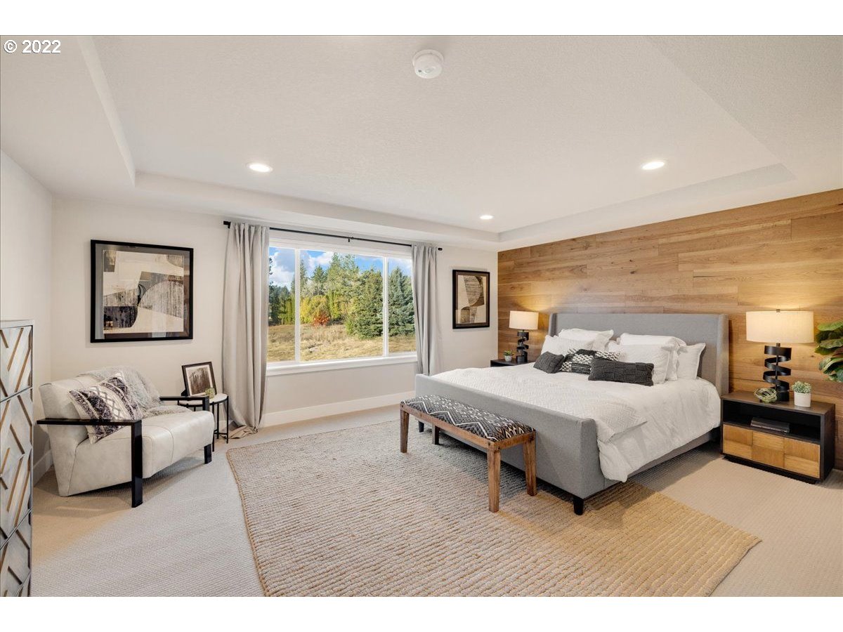 8534 North 5th Street, Unit LT 32 Ridgefield, WA 98642 - Photo 17 of 26 a living room with a bed furniture and a large window