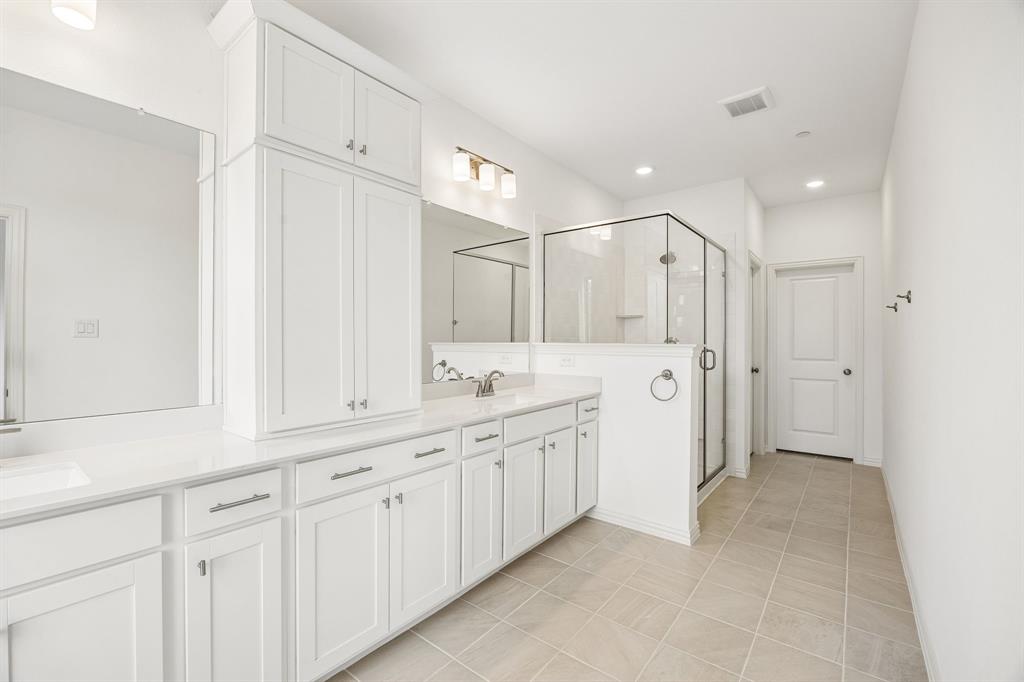 218 Dylan Way Midlothian, TX 76065 - Photo 12 of 15 Your new owner's suite comes complete with fantastic storage space, an oversized walk in shower and dream closets!