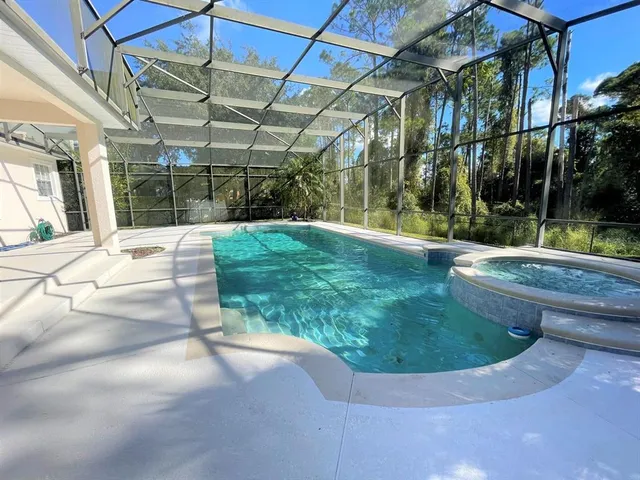a view of a livingroom with furniture and staircase