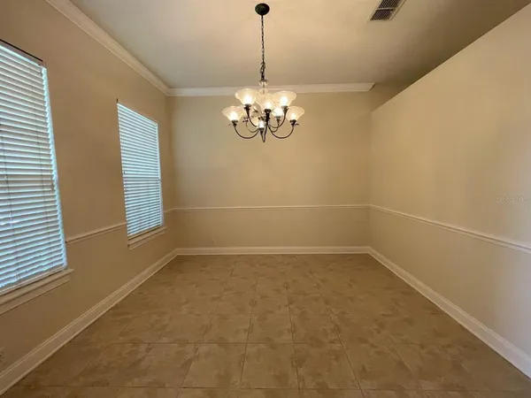 a view of a chandelier in an empty room