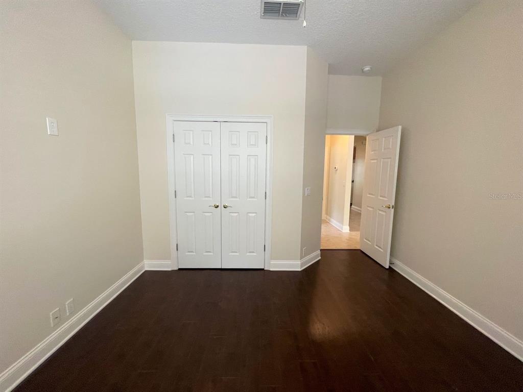 8447 Bowden Way Windermere, FL 34786 - Photo 10 of 21 an empty room with wooden floor