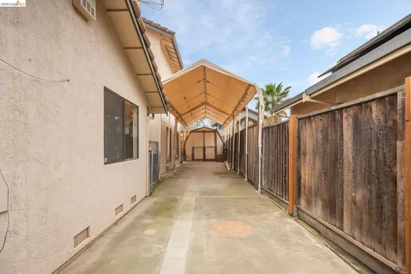 a front view of a house with a garden and plants