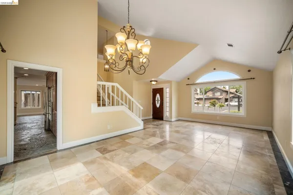 a view of an entryway with a chandelier