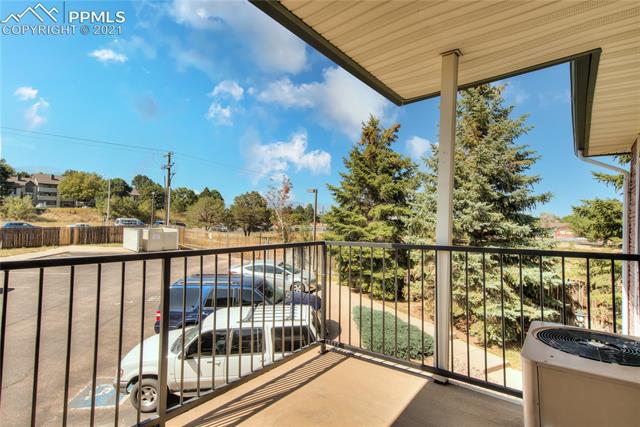 2002 Legacy Ridge View, Unit 201 Colorado Springs, CO 80910 - Photo 10 of 34 Relax on The Covered Deck