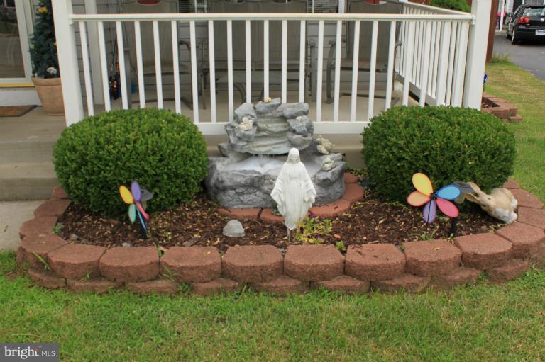 96 Yew Road Baltimore, MD 21221 - Photo 16 of 25 a garden view with a seating space
