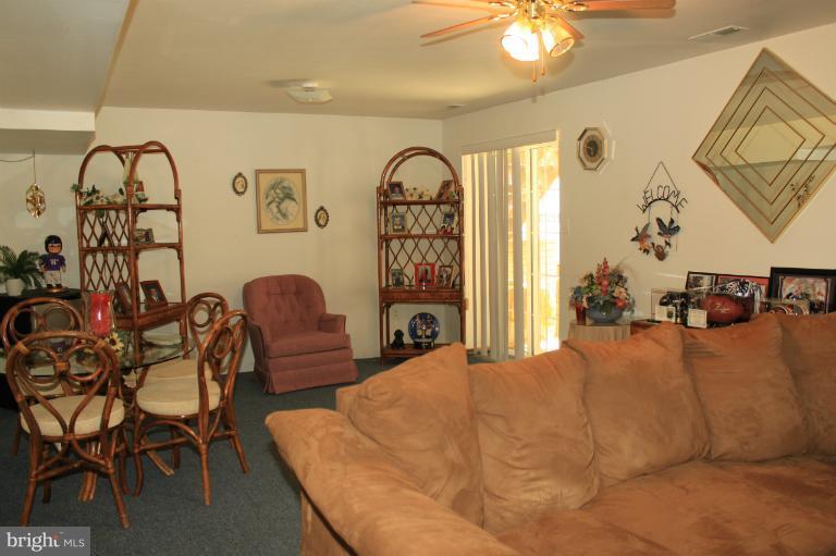 96 Yew Road Baltimore, MD 21221 - Photo 8 of 25 a bedroom with furniture and wooden floor