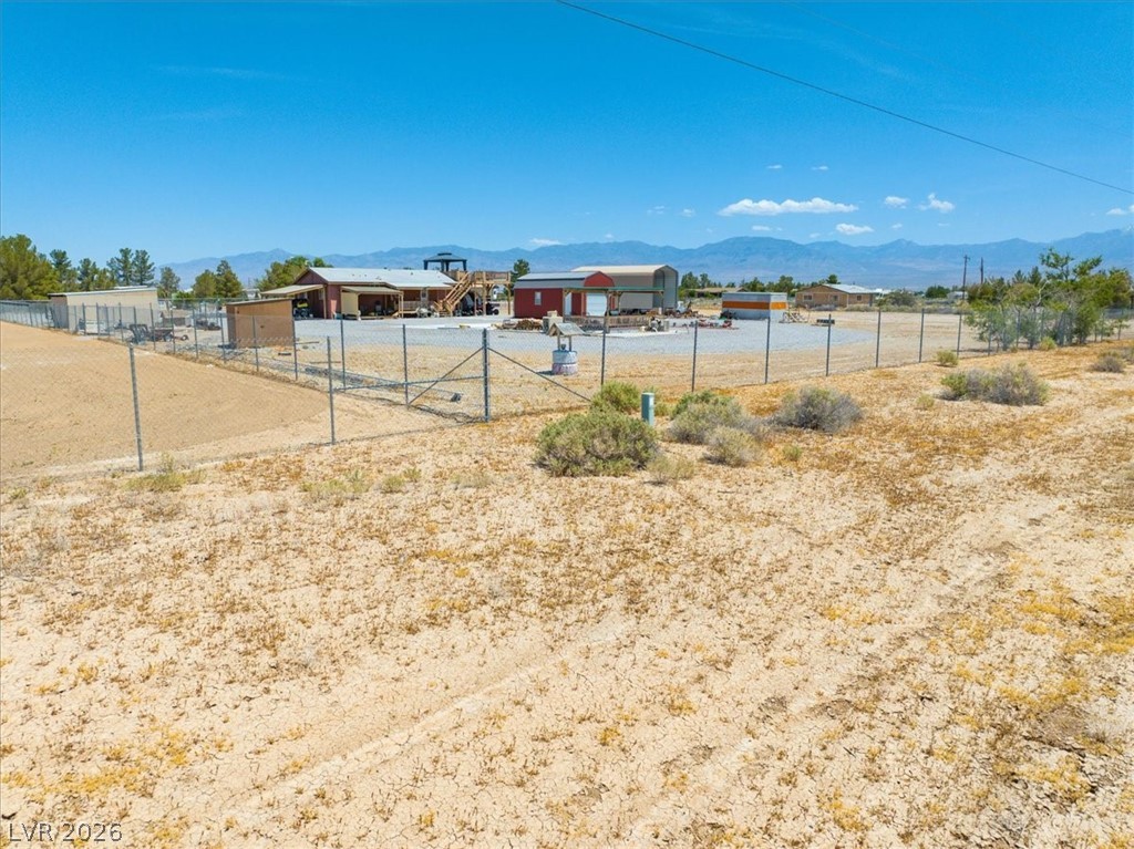 4610 Lawrence Road Pahrump, NV 89048 - Photo 10 of 42 A spacious desert property with functional buildings and mountain views.