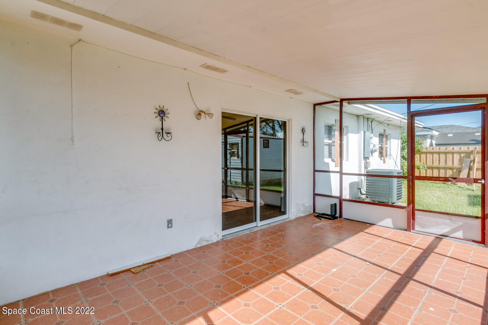 2655 Sarno Road Melbourne, FL 32935 - Photo 14 of 18 a view of a room with an empty room and windows