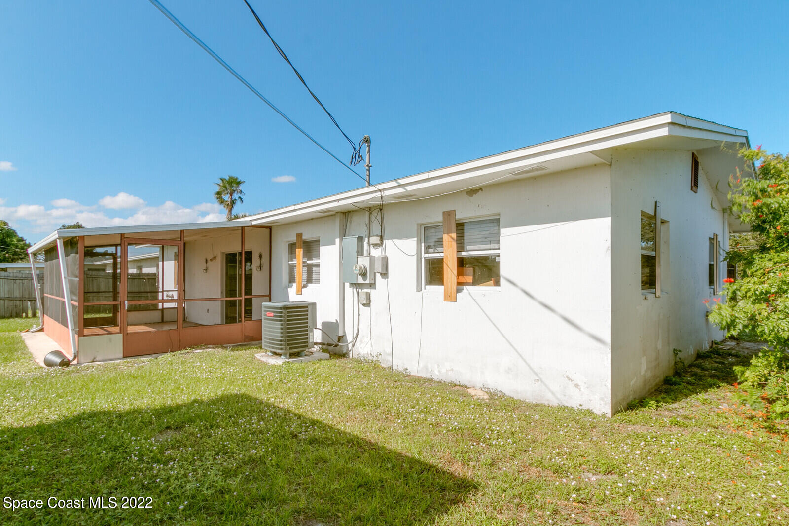 2655 Sarno Road Melbourne, FL 32935 - Photo 17 of 18 a view of a house with backyard and porch