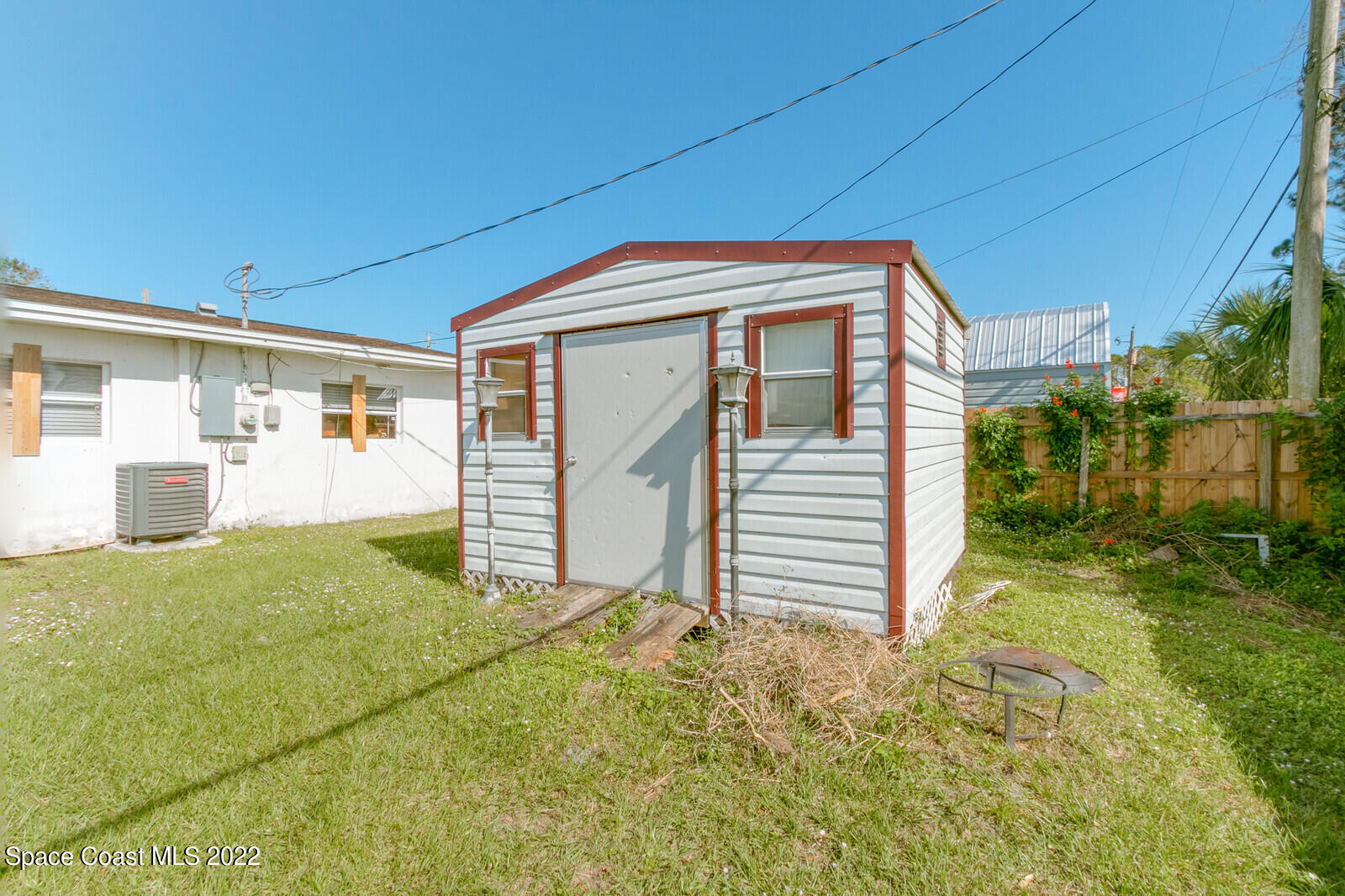 2655 Sarno Road Melbourne, FL 32935 - Photo 18 of 18 a view of a house with backyard and garage