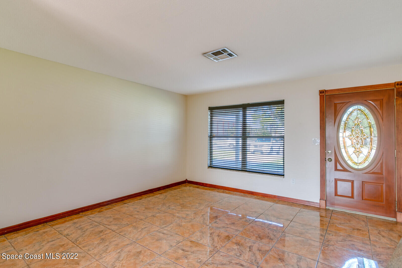 2655 Sarno Road Melbourne, FL 32935 - Photo 3 of 18 a view of an empty room with a window
