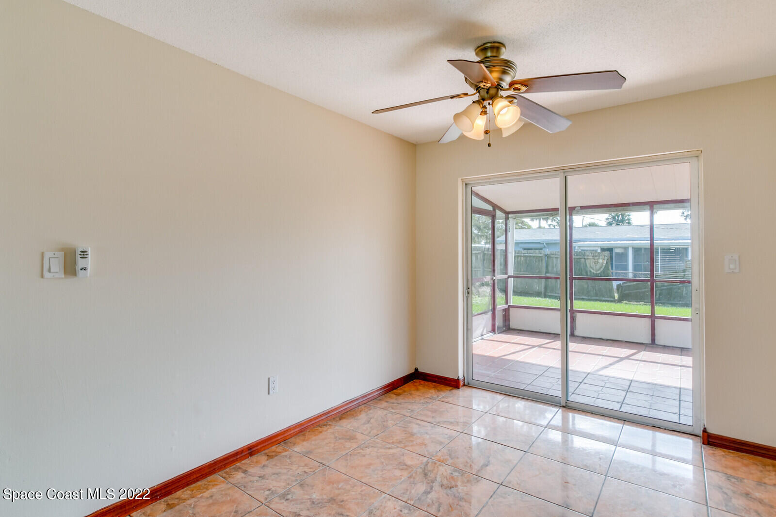 2655 Sarno Road Melbourne, FL 32935 - Photo 5 of 18 a view of an empty room with a window