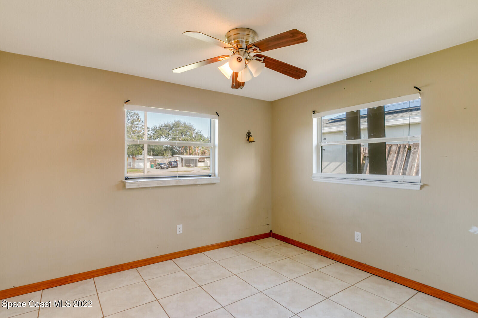 2655 Sarno Road Melbourne, FL 32935 - Photo 9 of 18 a view of an empty room with a window
