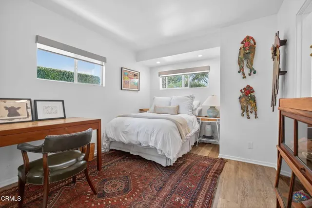 a view of a house with pool and sitting area