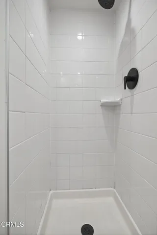 a view of a house with backyard sitting area and garden