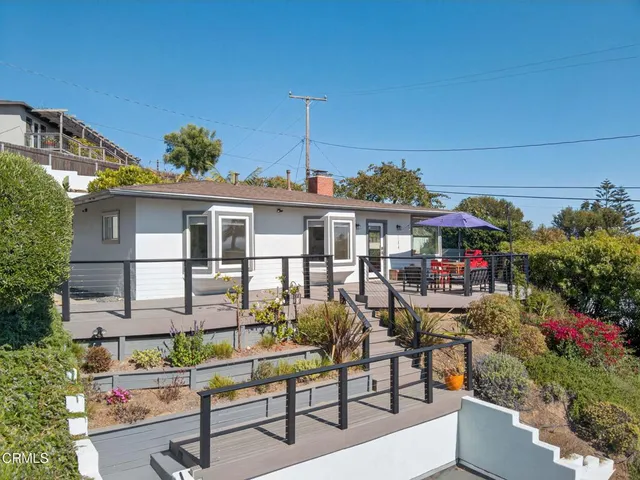 a view of a chairs and table in a patio