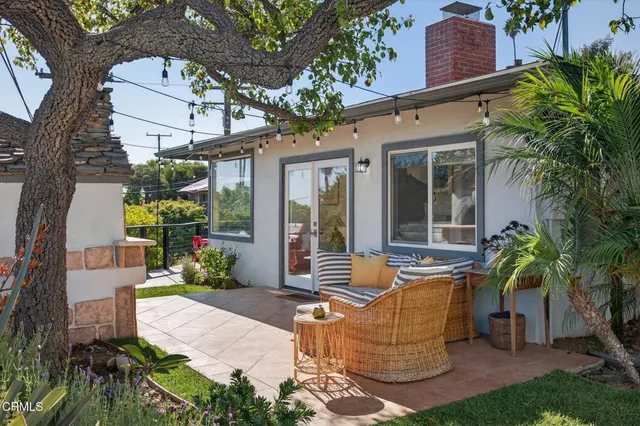 a view of a chairs and table in patio