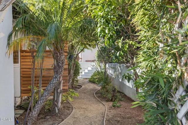 a view of a balcony with potted plants