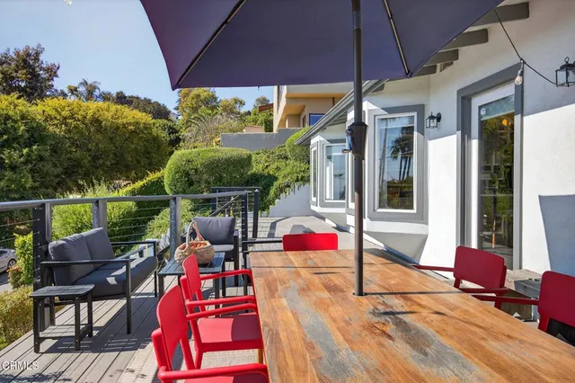a workspace with furniture and a potted plant