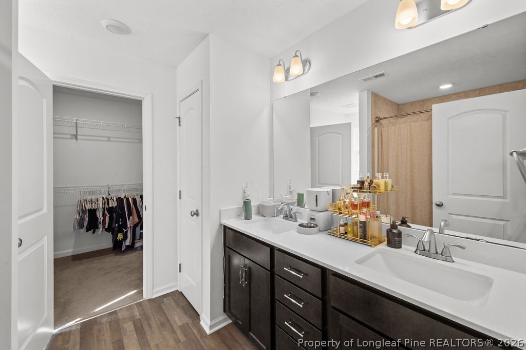 6915 Wickersham Road Fayetteville, NC 28314 - Photo 20 of 25 a bathroom with a sink double vanity