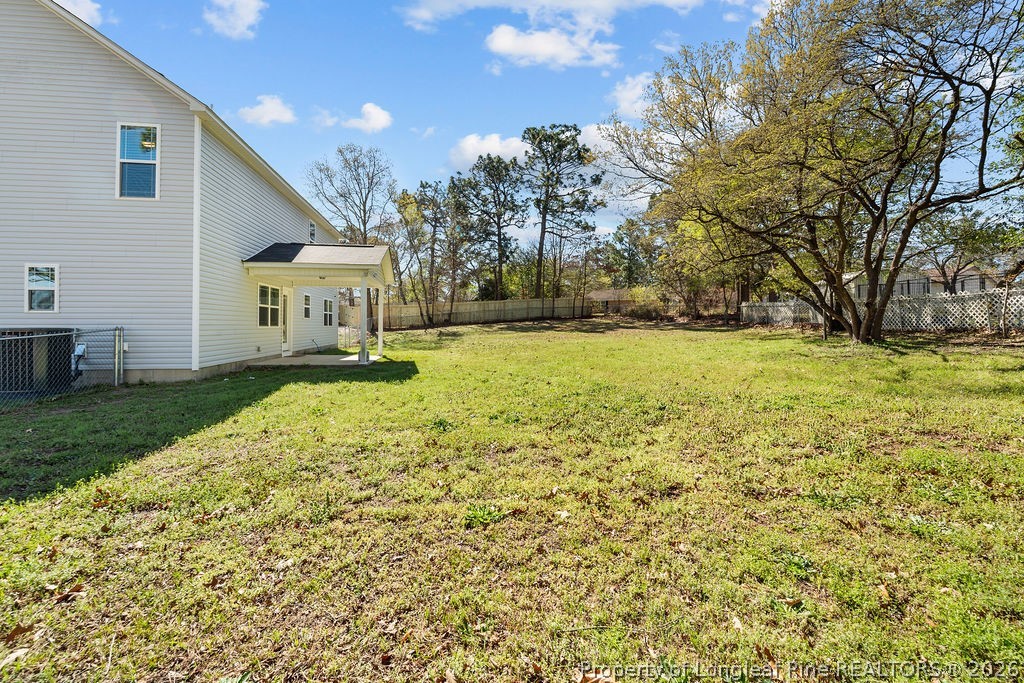 6915 Wickersham Road Fayetteville, NC 28314 - Photo 22 of 25 a swimming pool with yard and outdoor seating