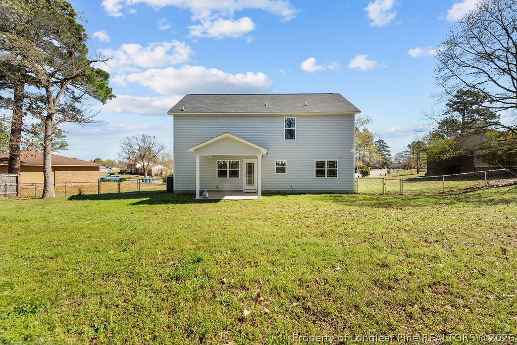 6915 Wickersham Road Fayetteville, NC 28314 - Photo 23 of 25 a front view of a house with a yard