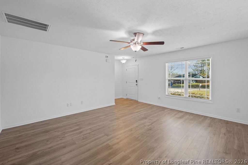 6915 Wickersham Road Fayetteville, NC 28314 - Photo 3 of 25 a view of an empty room with a window