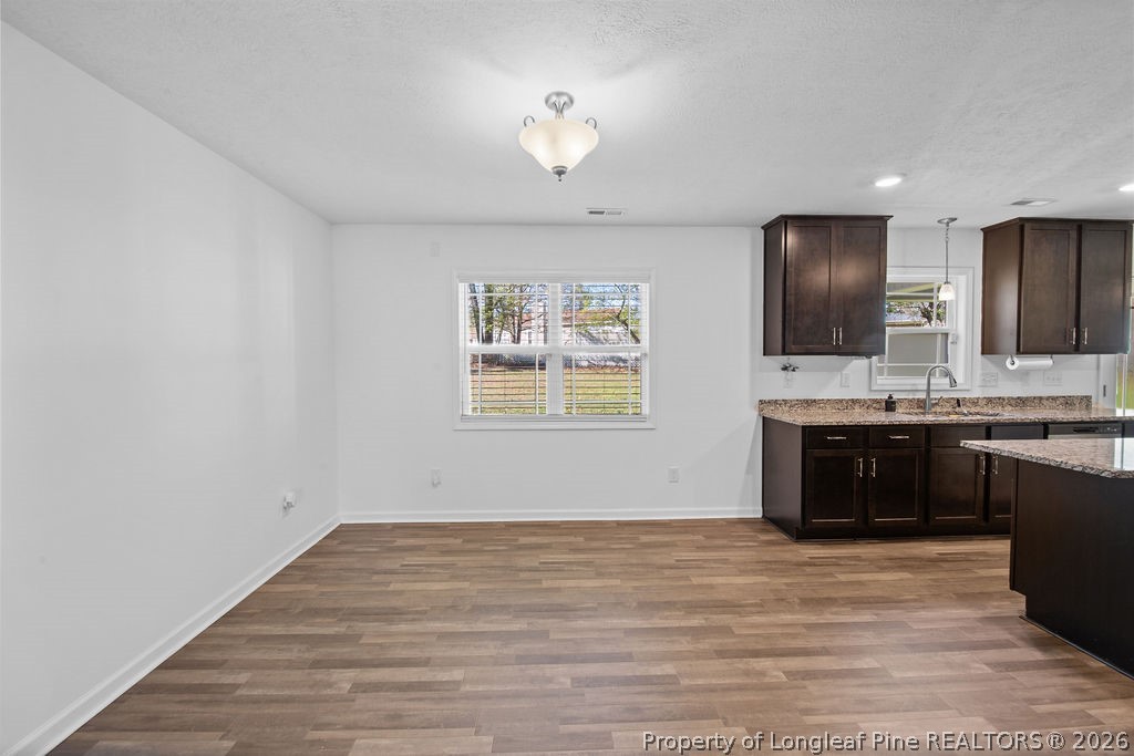 6915 Wickersham Road Fayetteville, NC 28314 - Photo 4 of 25 a bathroom with a sink vanity and a mirror