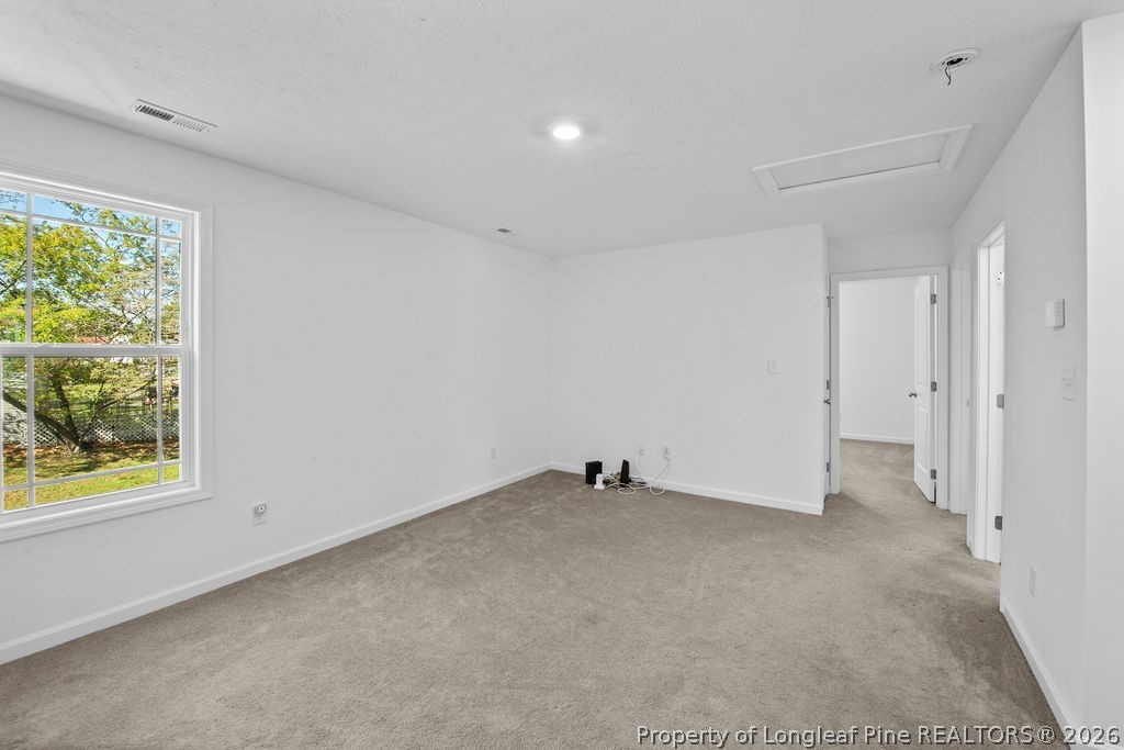 6915 Wickersham Road Fayetteville, NC 28314 - Photo 10 of 25 an empty room with a window