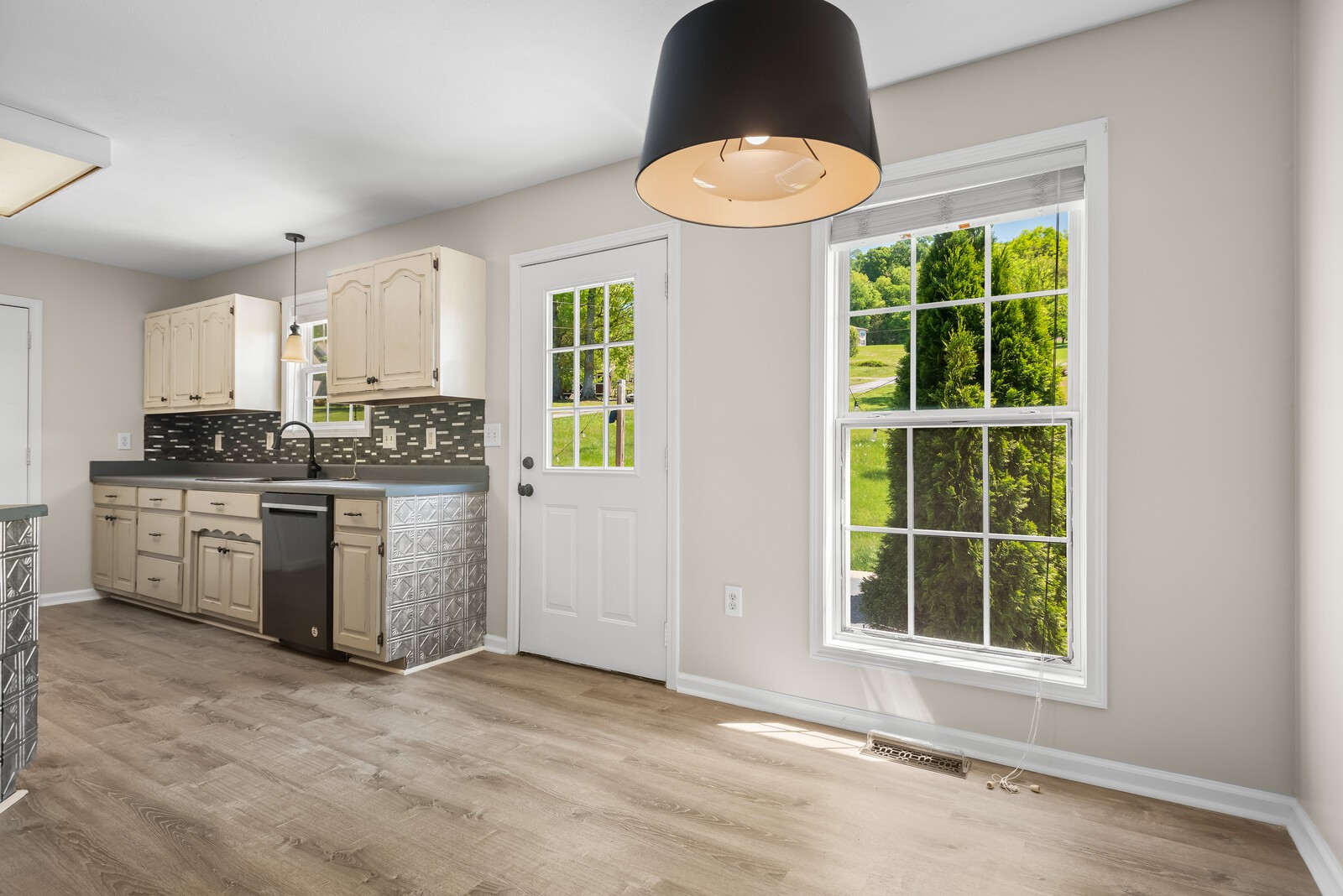 3850 Taylors Store Road Hampshire, TN 38461 - Photo 13 of 57 a kitchen with stainless steel appliances granite countertop a stove a sink and a window