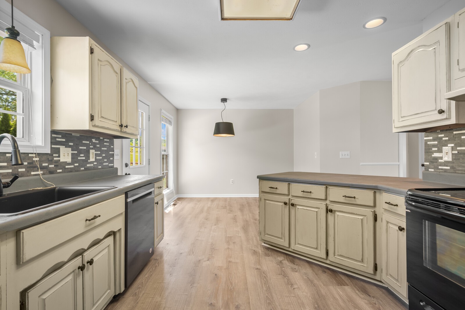 3850 Taylors Store Road Hampshire, TN 38461 - Photo 14 of 57 a kitchen with granite countertop a sink cabinets stainless steel appliances and a window