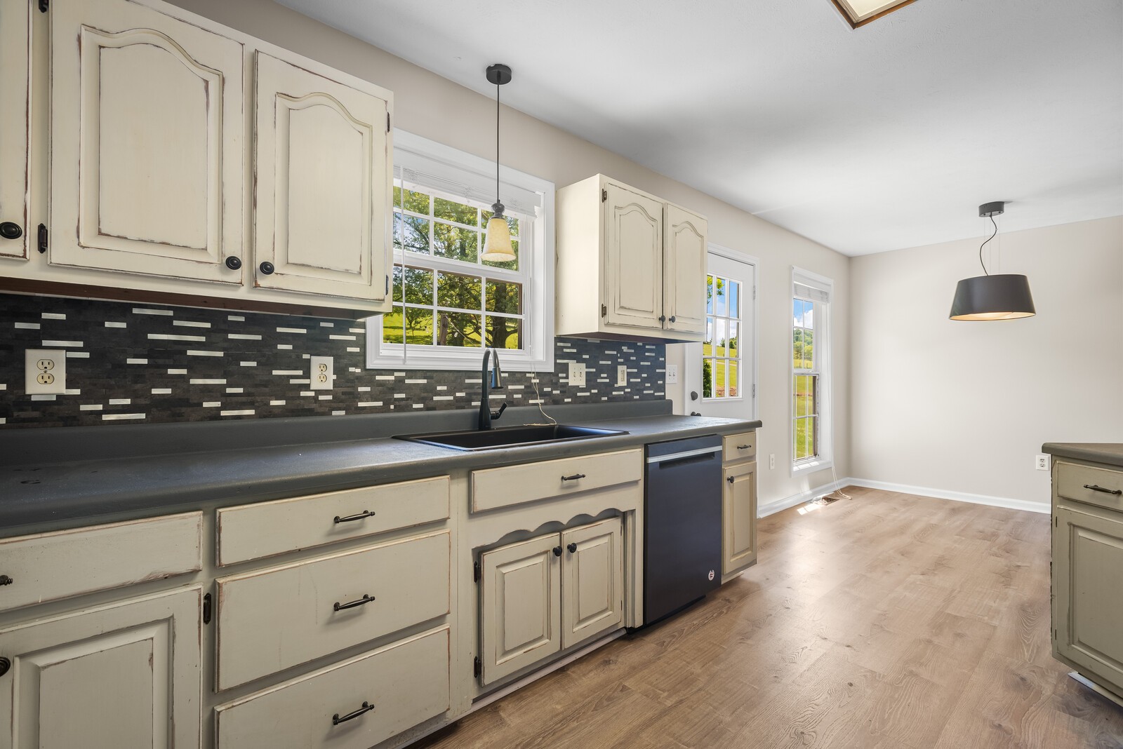 3850 Taylors Store Road Hampshire, TN 38461 - Photo 15 of 57 a kitchen with granite countertop white cabinets and stainless steel appliances
