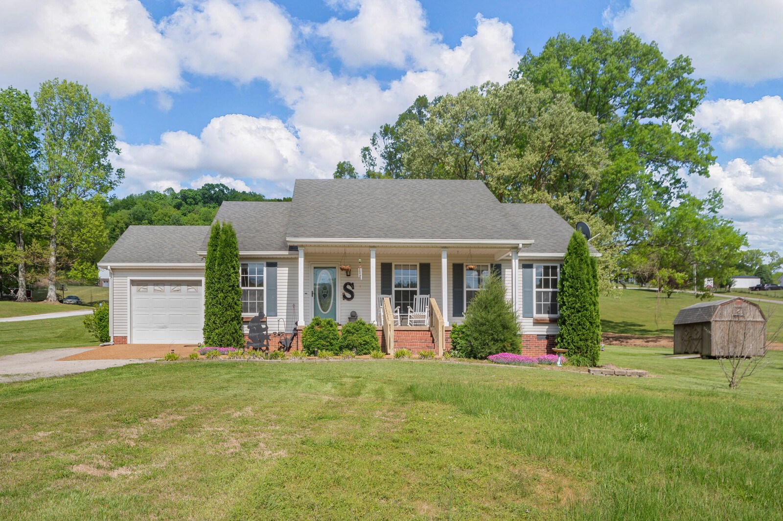 3850 Taylors Store Road Hampshire, TN 38461 - Photo 2 of 57 a front view of a house with garden