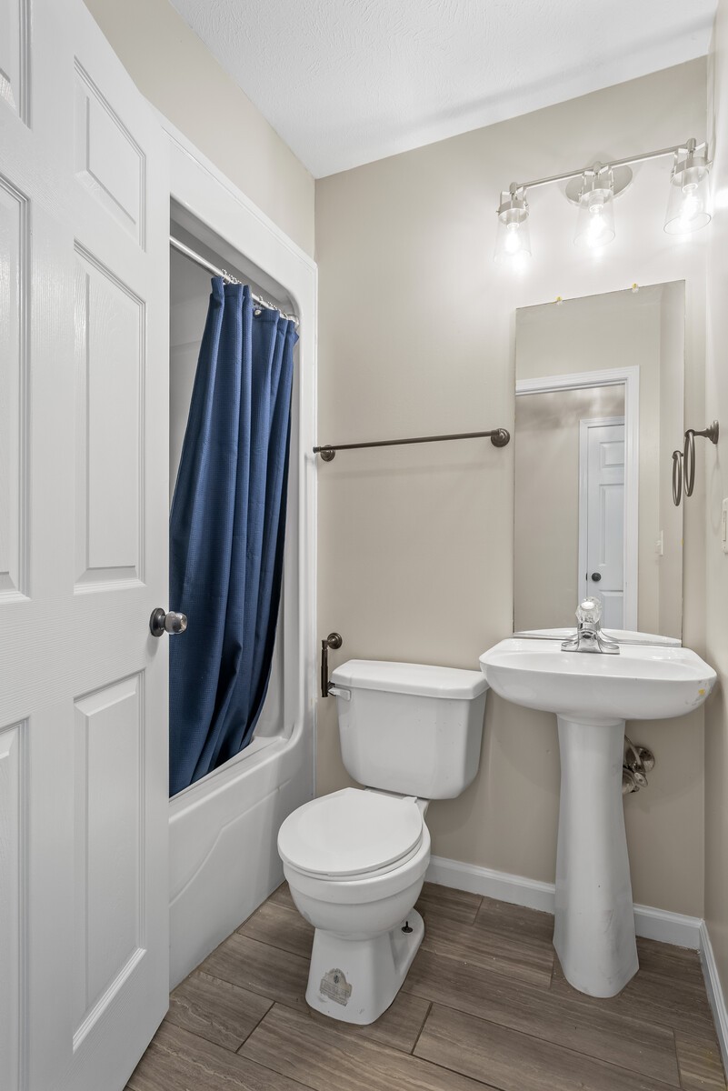 3850 Taylors Store Road Hampshire, TN 38461 - Photo 21 of 57 a bathroom with a toilet a sink and a mirror