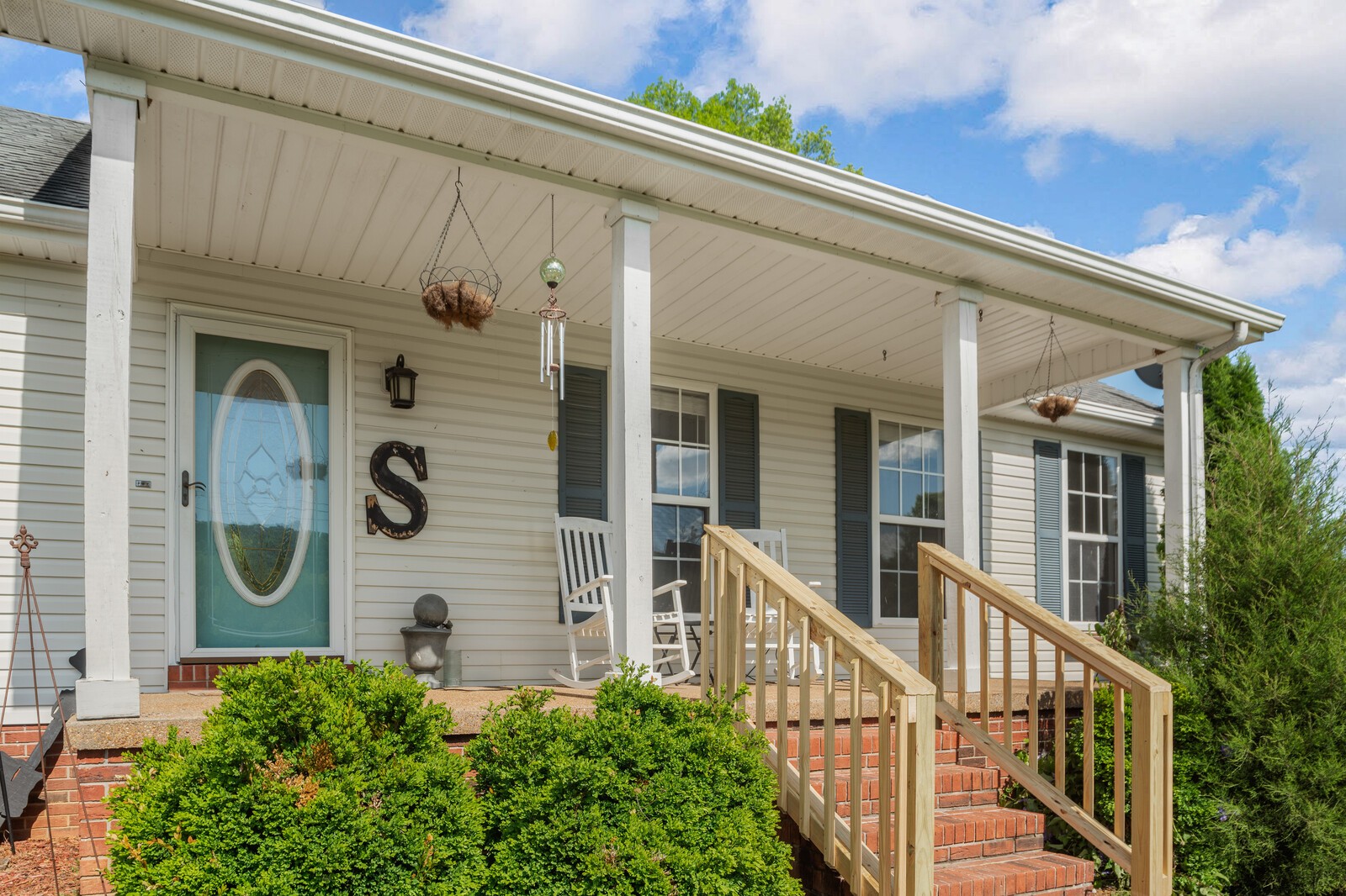 3850 Taylors Store Road Hampshire, TN 38461 - Photo 3 of 57 a view of a house with a large window and stairs