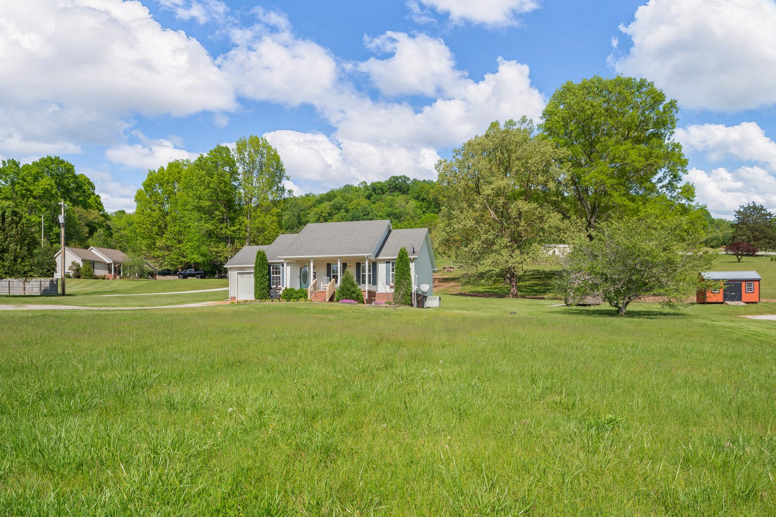 3850 Taylors Store Road Hampshire, TN 38461 - Photo 31 of 57 a view of a house with a big yard and large trees