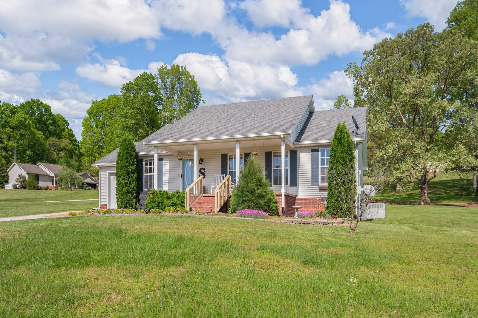3850 Taylors Store Road Hampshire, TN 38461 - Photo 36 of 57 a front view of a house with swing and garden