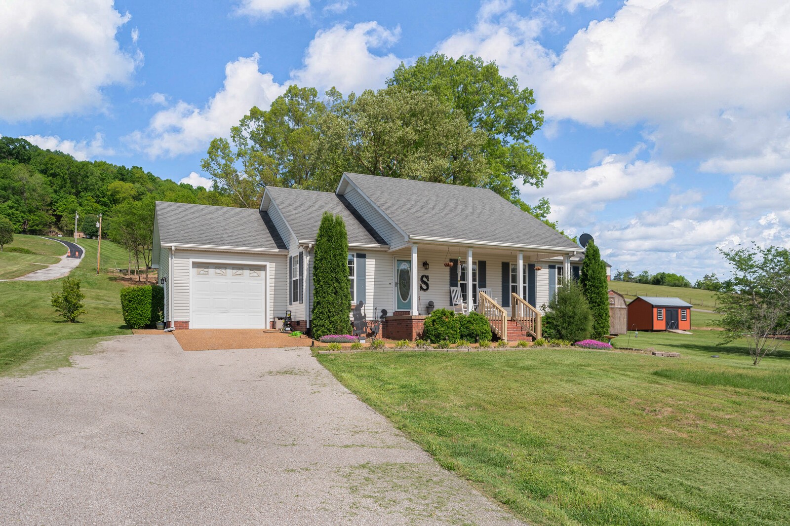 3850 Taylors Store Road Hampshire, TN 38461 - Photo 53 of 57 a front view of a house with a yard and garage