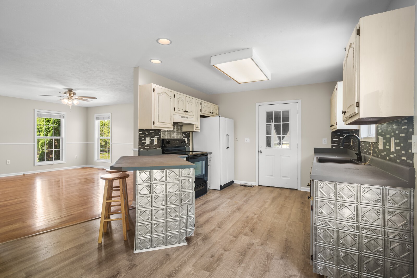 3850 Taylors Store Road Hampshire, TN 38461 - Photo 9 of 57 a kitchen with granite countertop a stove top oven a sink dishwasher and a refrigerator with wooden floor