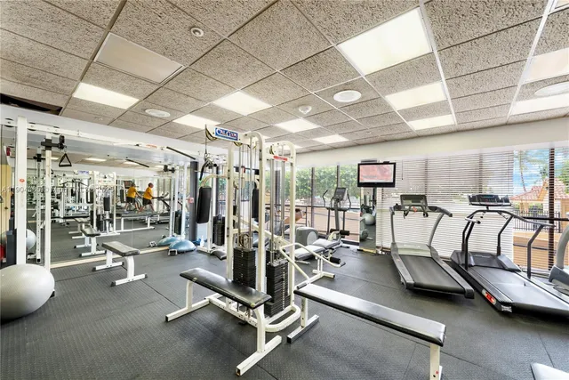a view of swimming pool with outdoor seating and plants