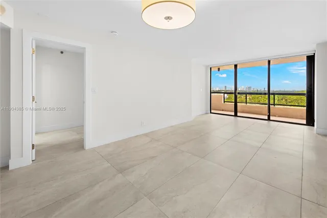 an empty room with sliding glass door