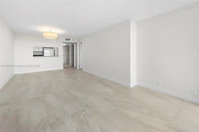 a view of a kitchen with a sink and a cabinet