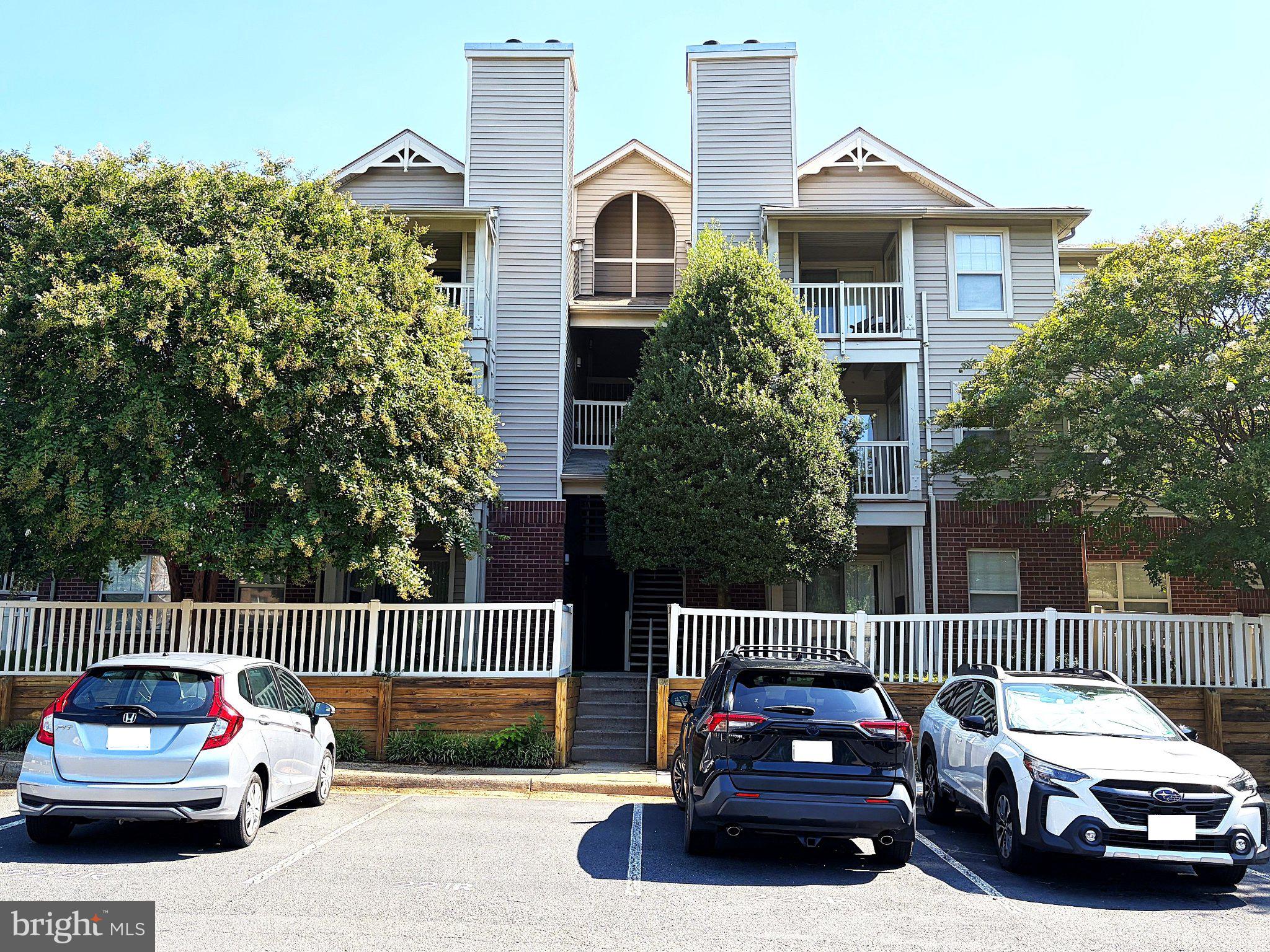 11653 Gas Light Court, Unit H Reston, VA 20190 - Photo 1 of 28 Charming apartment complex with greenery.