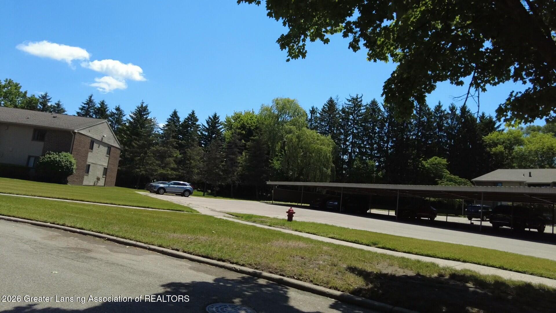 5400 Maple Road, Unit 29 Haslett, MI 48840 - Photo 3 of 11 carport