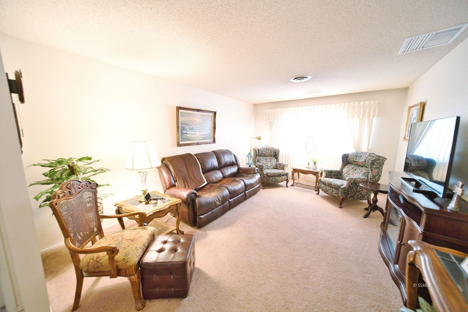 1024 Sherri Street Ridgecrest, CA 93555 - Photo 6 of 41 a living room with furniture and a flat screen tv