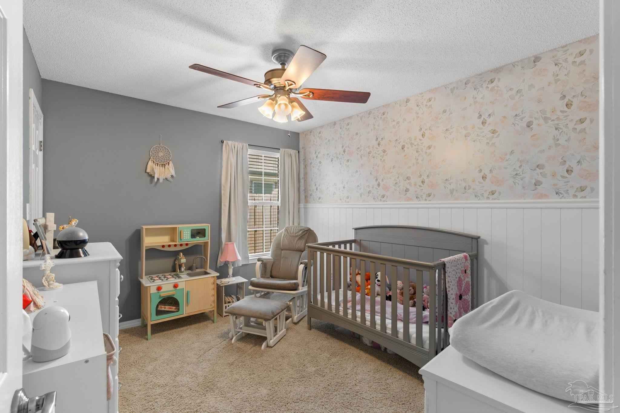 8046 Castle Pointe Way Pensacola, FL 32506 - Photo 19 of 40 a bedroom with furniture and a window