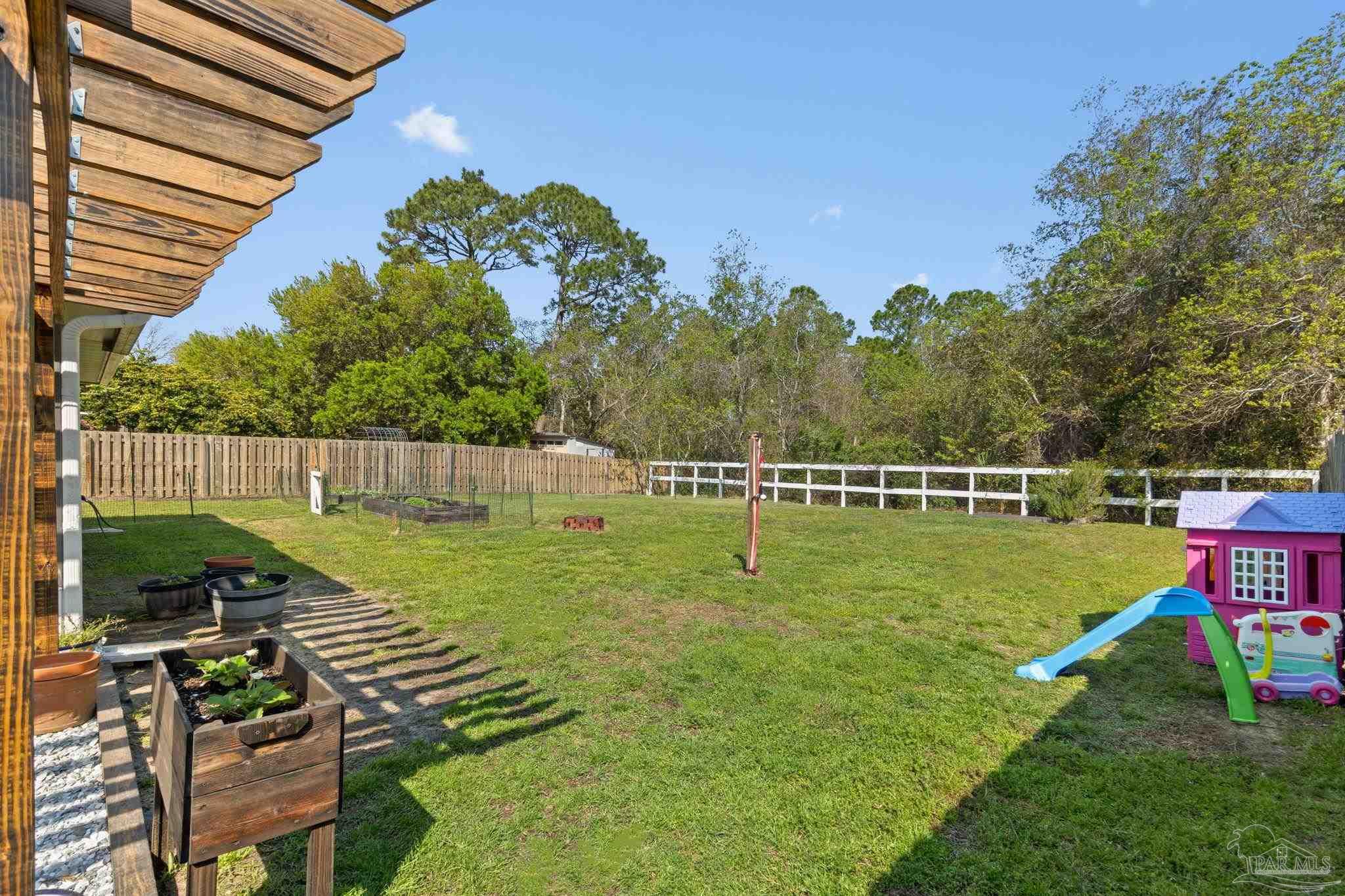 8046 Castle Pointe Way Pensacola, FL 32506 - Photo 29 of 40 a view of a park with swings