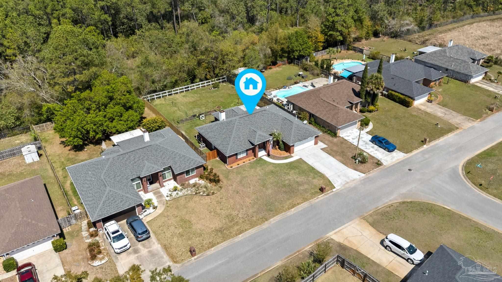 8046 Castle Pointe Way Pensacola, FL 32506 - Photo 34 of 40 an aerial view of a house with swimming pool